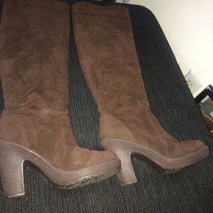 Brown knee high boots.